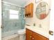 Bathroom with walk-in shower, updated fixtures, and marble walls at 2021 Wildfire Ct, Apopka, FL 32703