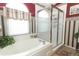 Bathroom featuring a garden tub and a separate shower at 2021 Wildfire Ct, Apopka, FL 32703