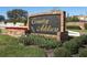 Community sign, 'Country Address', framed by brickwork and lush landscaping, welcomes residents and visitors at 2021 Wildfire Ct, Apopka, FL 32703