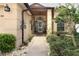 Inviting front entrance with a walkway leading to a glass-paneled front door at 2021 Wildfire Ct, Apopka, FL 32703