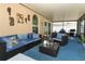 Inviting screened-in patio featuring comfortable seating, perfect for outdoor relaxation and dining at 2021 Wildfire Ct, Apopka, FL 32703