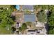 Aerial view showcases a large lot with backyard shed at 215 Bradbury Ave, Oak Hill, FL 32759