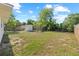 Spacious backyard features a shed, chicken coop, and partial fencing at 215 Bradbury Ave, Oak Hill, FL 32759