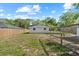 Large backyard includes storage shed and chicken coop at 215 Bradbury Ave, Oak Hill, FL 32759