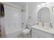 Bright bathroom with a shower, toilet and new vanity and fixtures at 215 Bradbury Ave, Oak Hill, FL 32759