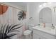 Stylishly updated bathroom with a modern shower curtain, fixtures, and decor at 215 Bradbury Ave, Oak Hill, FL 32759