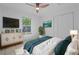 Bright bedroom with a ceiling fan, closet, and views of the outdoors at 215 Bradbury Ave, Oak Hill, FL 32759