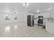 Modern kitchen with stainless steel appliances and white cabinetry at 215 Bradbury Ave, Oak Hill, FL 32759