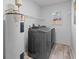 Convenient laundry room includes washer, dryer, and water heater at 215 Bradbury Ave, Oak Hill, FL 32759