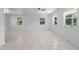 Spacious living room with tile flooring and plenty of natural light at 215 Bradbury Ave, Oak Hill, FL 32759
