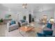 Stylishly staged living room with modern furnishings and neutral color palette at 215 Bradbury Ave, Oak Hill, FL 32759