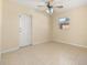 Bedroom featuring tile flooring, a ceiling fan, and a window that provides natural light at 2222 Catherine St, Kissimmee, FL 34741