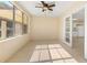 Bright and airy Florida room with tile floors and neutral paint at 2222 Catherine St, Kissimmee, FL 34741