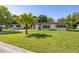 Quaint single-story home with a well-manicured front lawn and mature trees at 2222 Catherine St, Kissimmee, FL 34741