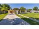Inviting single-story home with a spacious driveway and lush green lawn at 2222 Catherine St, Kissimmee, FL 34741
