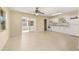 Spacious kitchen featuring tile flooring, ample cabinet space, and modern appliances, open to a bright dining area at 2222 Catherine St, Kissimmee, FL 34741
