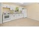 Bright kitchen with white cabinets, granite countertops, and modern appliances at 2222 Catherine St, Kissimmee, FL 34741