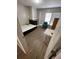 Bedroom featuring wood-look floors, natural light, and a neutral paint scheme at 2236 Stonington Ave # 2236, Orlando, FL 32817