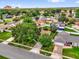 Neighborhood aerial view showcasing the home's mature trees, landscaping, and proximity to community amenities at 2344 Whispering Maple Dr., Orlando, FL 32837