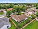 Aerial view of a fenced property showing the home and screened porch surrounded by mature trees and landscaping at 2344 Whispering Maple Dr., Orlando, FL 32837