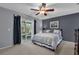 Comfortable bedroom with sliding glass door to patio and backyard at 2344 Whispering Maple Dr., Orlando, FL 32837