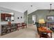 Open living space with views of the kitchen, comfortable seating, and neutral paint and flooring at 2344 Whispering Maple Dr., Orlando, FL 32837