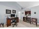 Home office with vaulted ceilings and a view into the kitchen at 2344 Whispering Maple Dr., Orlando, FL 32837