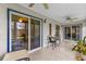 Covered porch with tile flooring and sliding glass door to home at 2344 Whispering Maple Dr., Orlando, FL 32837