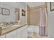 Well-lit bathroom featuring granite counters, modern fixtures, and a shower-tub combination at 2401 Mayer St, Orlando, FL 32806