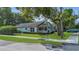 Charming home with a well-manicured front yard, landscaping, and a cozy front porch at 2401 Mayer St, Orlando, FL 32806