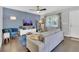 Comfortable living room with hardwood floors, stylish furniture, and a blue accent wall at 2401 Mayer St, Orlando, FL 32806