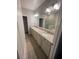Bathroom features a double vanity with granite countertops at 2937 Econ Landing Blvd, Orlando, FL 32825