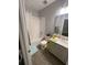 Bathroom features a shower, tub and white vanity at 2937 Econ Landing Blvd, Orlando, FL 32825