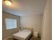 Bedroom features a simple design with a window at 2937 Econ Landing Blvd, Orlando, FL 32825