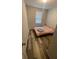 Bedroom features a cozy bed and natural light at 2937 Econ Landing Blvd, Orlando, FL 32825