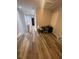 Hallway boasts wood floors and plenty of natural light at 2937 Econ Landing Blvd, Orlando, FL 32825