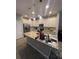 Spacious kitchen with granite countertops, island, and pendant lighting at 2937 Econ Landing Blvd, Orlando, FL 32825