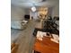 View of an open concept living space, dining, and kitchen layout at 2937 Econ Landing Blvd, Orlando, FL 32825