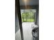 Enclosed patio with outdoor seating and view of the backyard at 2937 Econ Landing Blvd, Orlando, FL 32825