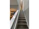 Staircase with white risers leading to the upper level at 2937 Econ Landing Blvd, Orlando, FL 32825