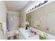 Well-lit bathroom with a shower-tub combination, vanity with sink, and modern fixtures, offering functionality and style at 3044 Camino Real S Dr, Kissimmee, FL 34744