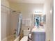 Full bathroom with shower and tub combination, modern vanity, and neutral decor at 3044 Camino Real S Dr, Kissimmee, FL 34744