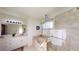 The modern bathroom features a glass shower and a garden tub at 3044 Camino Real S Dr, Kissimmee, FL 34744