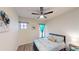 Serene bedroom featuring a comfortable bed, ample lighting, and simple decor, creating a relaxing and inviting atmosphere at 3044 Camino Real S Dr, Kissimmee, FL 34744