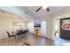 Dining room featuring a chandelier, a TV on the wall, and wood flooring at 3044 Camino Real S Dr, Kissimmee, FL 34744