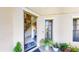 Close up of the front door featuring a view of the staircase and living area at 3044 Camino Real S Dr, Kissimmee, FL 34744