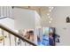 Bright foyer with high ceilings, chandelier, and staircase leading to the second floor at 3044 Camino Real S Dr, Kissimmee, FL 34744
