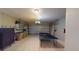 Spacious garage with tile floor, ping pong table, and ample storage space at 3044 Camino Real S Dr, Kissimmee, FL 34744