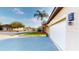 View of the garage and landscaped front yard of this single-Gathering home at 3044 Camino Real S Dr, Kissimmee, FL 34744