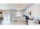 Modern kitchen with stainless steel appliances, white cabinets, and ample counter space, perfect for preparing meals and entertaining guests at 3044 Camino Real S Dr, Kissimmee, FL 34744